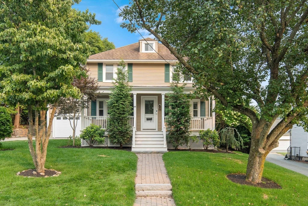 60 Rosemary Street Needham, MA 02494 - Photo 2 of 29 a front view of a house with garden