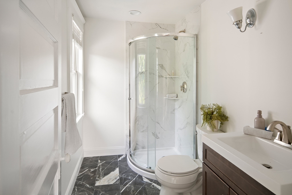 60 Rosemary Street Needham, MA 02494 - Photo 21 of 29 a bathroom with a sink toilet and shower