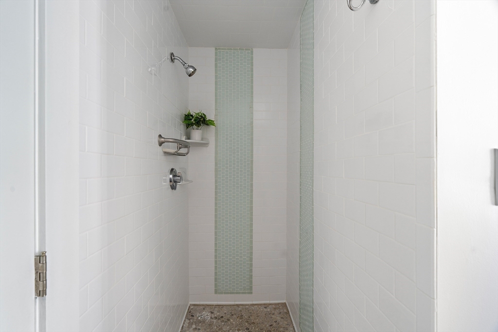60 Rosemary Street Needham, MA 02494 - Photo 24 of 29 a bathroom with a shower