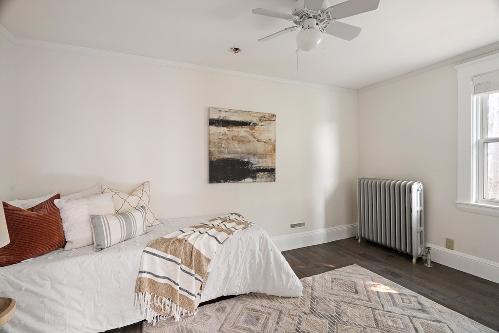 60 Rosemary Street Needham, MA 02494 - Photo 25 of 29 a bedroom with a bed and a window