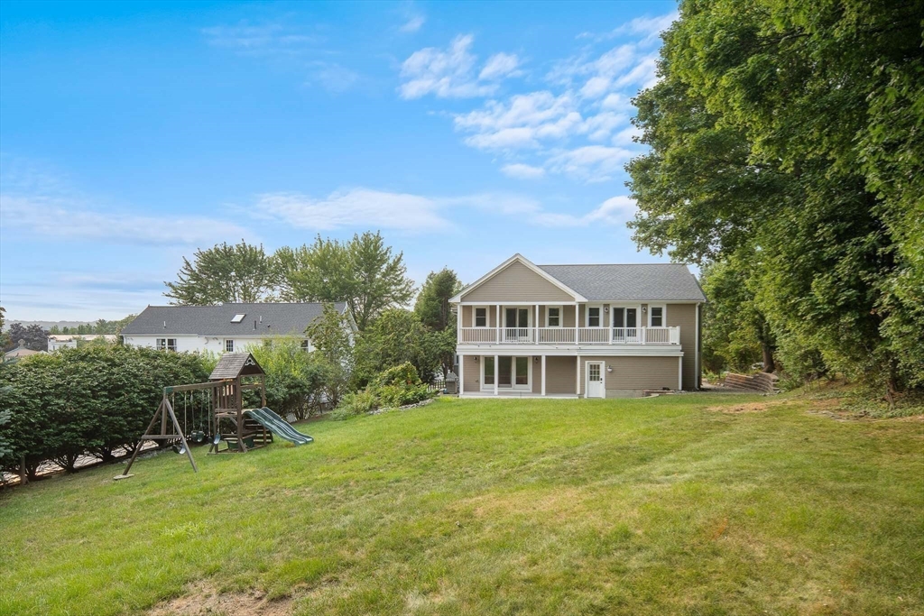 60 Rosemary Street Needham, MA 02494 - Photo 27 of 29 a view of a house with garden and trees