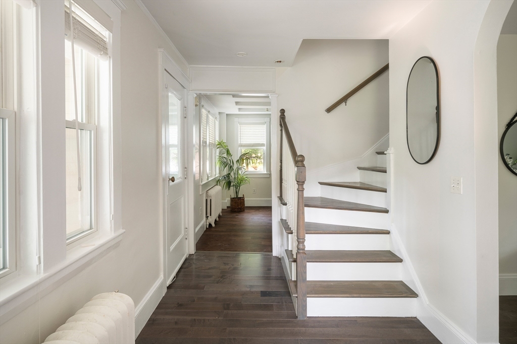 60 Rosemary Street Needham, MA 02494 - Photo 9 of 29 a view of a bathroom with staircase and white walls