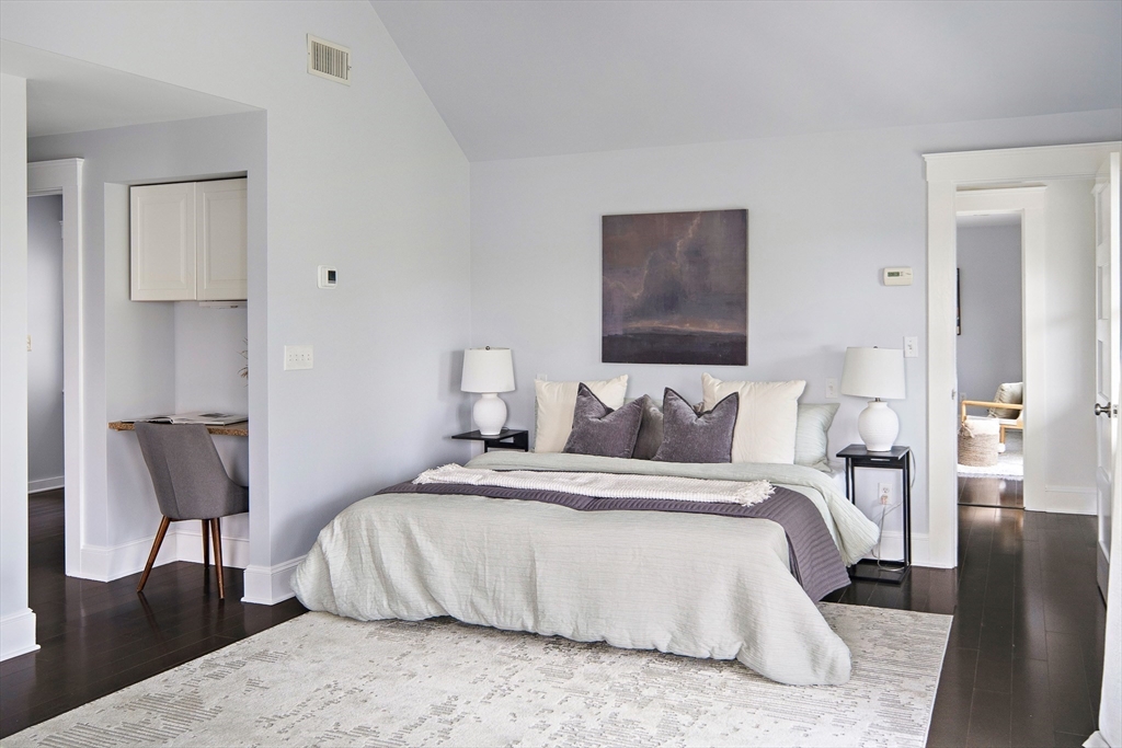 60 Rosemary Street Needham, MA 02494 - Photo 10 of 29 a bedroom with a bed and a chair