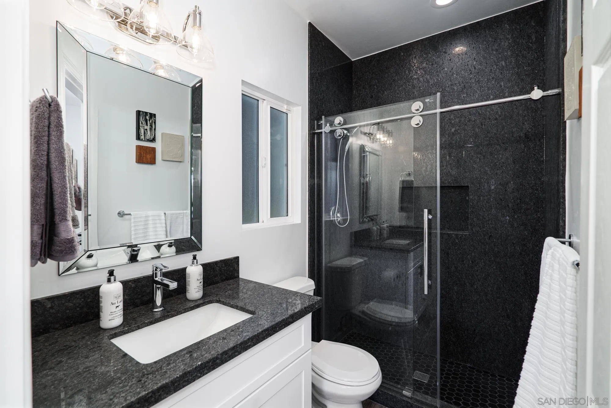 Sierra Madre Rd Spring Valley Spring Valley, CA 91977 - Photo 13 of 19 a bathroom with a sink a toilet and shower