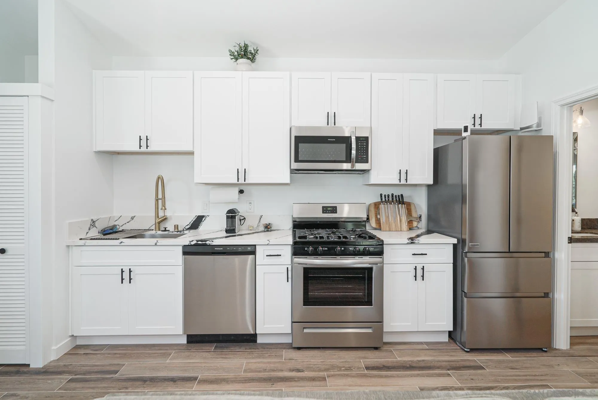 Sierra Madre Rd Spring Valley Spring Valley, CA 91977 - Photo 5 of 19 a kitchen with stainless steel appliances granite countertop a stove a refrigerator and a sink