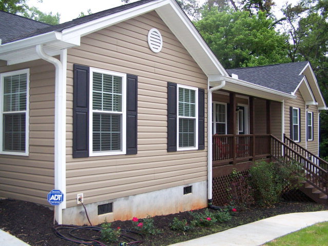 232 Sanders Road, Unit 6 Macon, GA 31210 - Photo 14 of 16 a view of a white house next to a yard