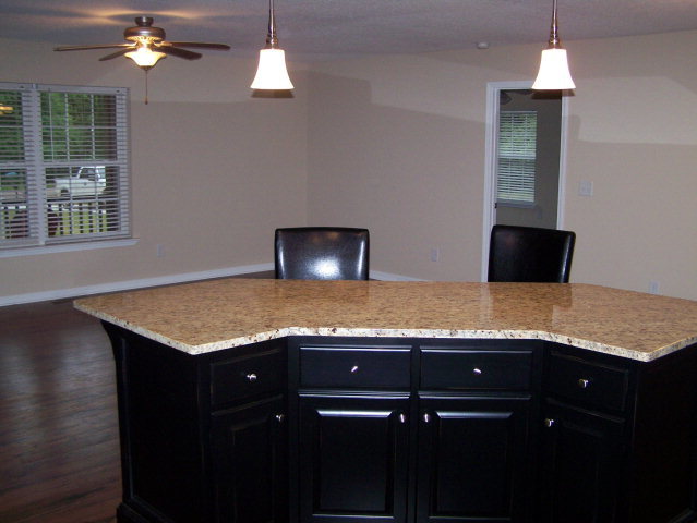 232 Sanders Road, Unit 6 Macon, GA 31210 - Photo 3 of 16 a view of a kitchen with kitchen island a counter top space appliances and a chandelier