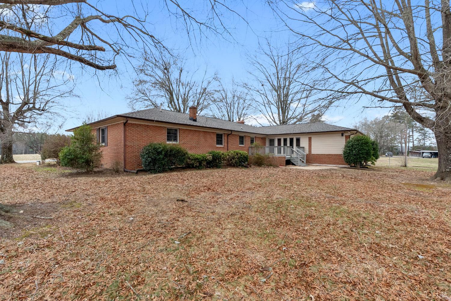 7092 Stage Coach Road Nathalie, VA 24577 - Photo 2 of 57 a front view of a house with garden