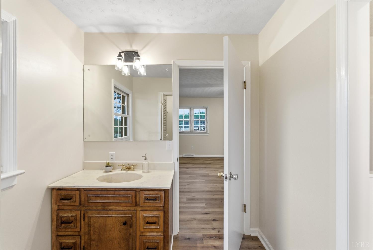 7092 Stage Coach Road Nathalie, VA 24577 - Photo 27 of 57 a bathroom with a sink and a mirror