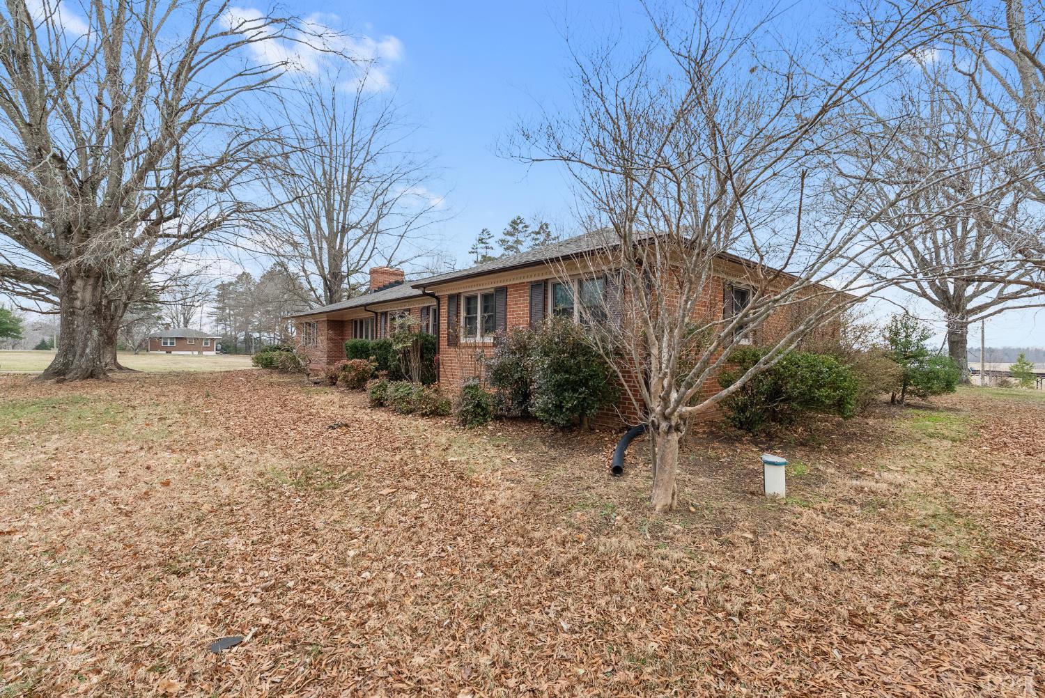 7092 Stage Coach Road Nathalie, VA 24577 - Photo 3 of 57 a view of a house with a yard covered in snow
