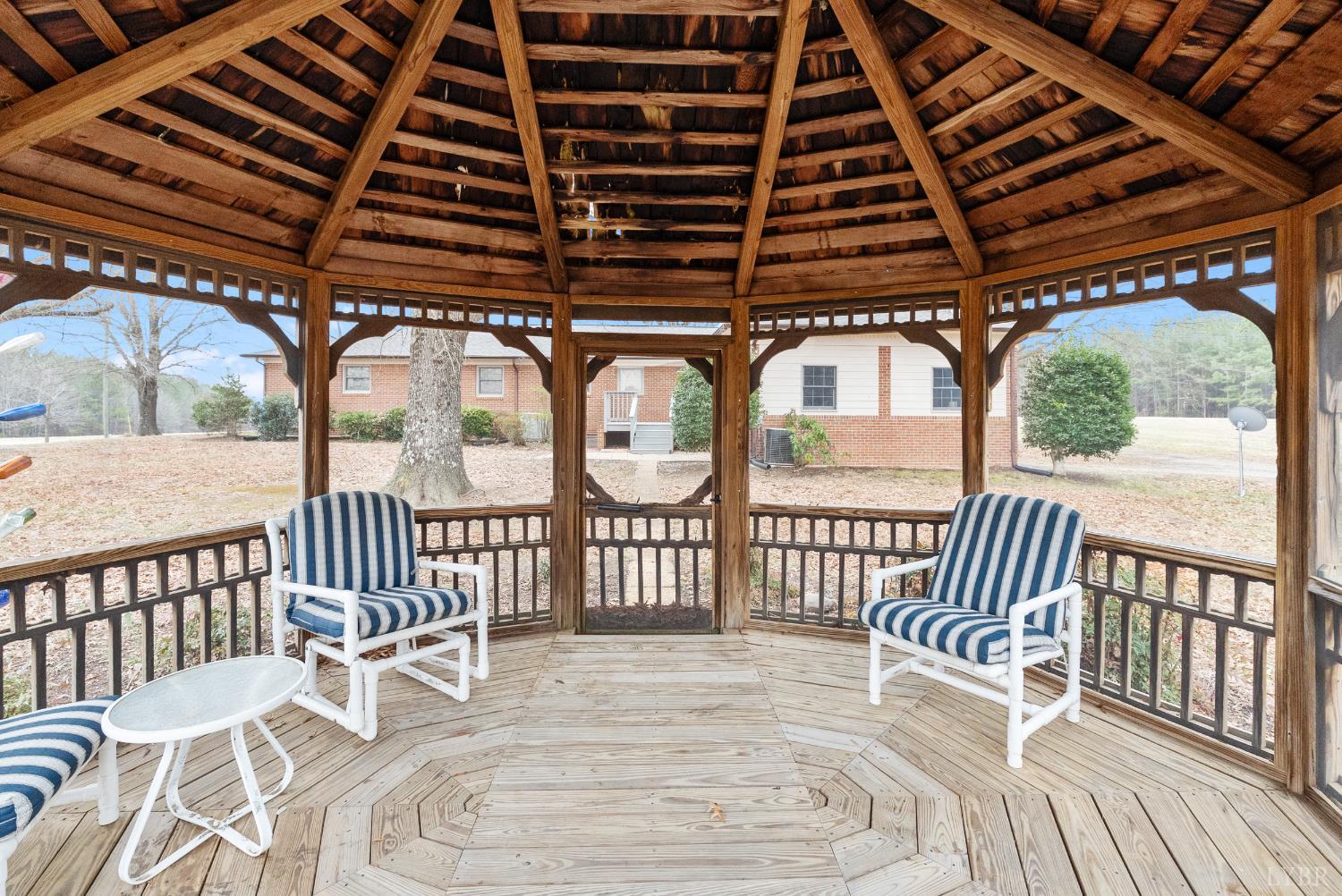 7092 Stage Coach Road Nathalie, VA 24577 - Photo 56 of 57 a view of a chair and tables in the balcony