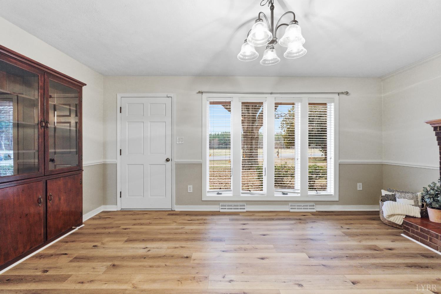 7092 Stage Coach Road Nathalie, VA 24577 - Photo 7 of 57 a view of empty room with wooden floor and fan