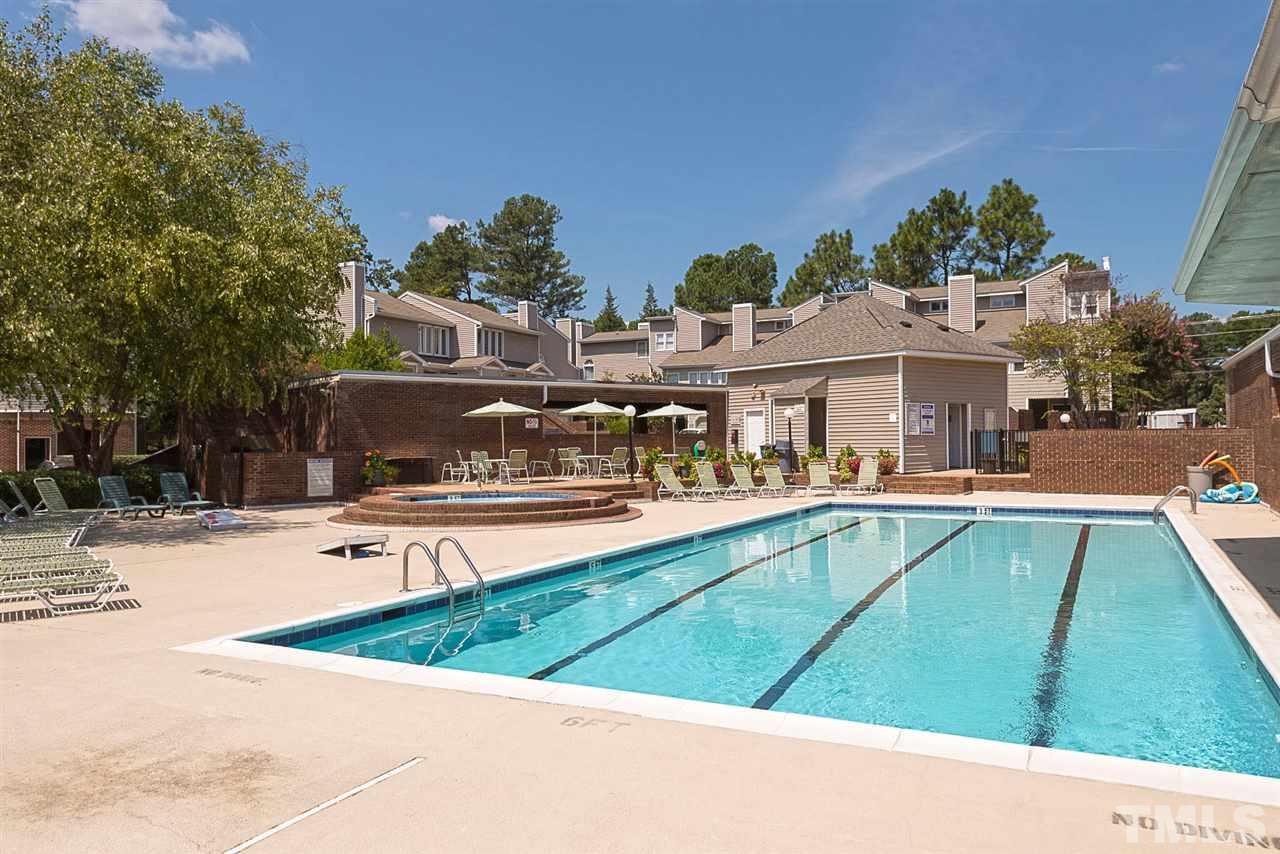 7010 Sandy Forks Road, Unit 108 Raleigh, NC 27615 - Photo 22 of 22 a view of a swimming pool with a patio