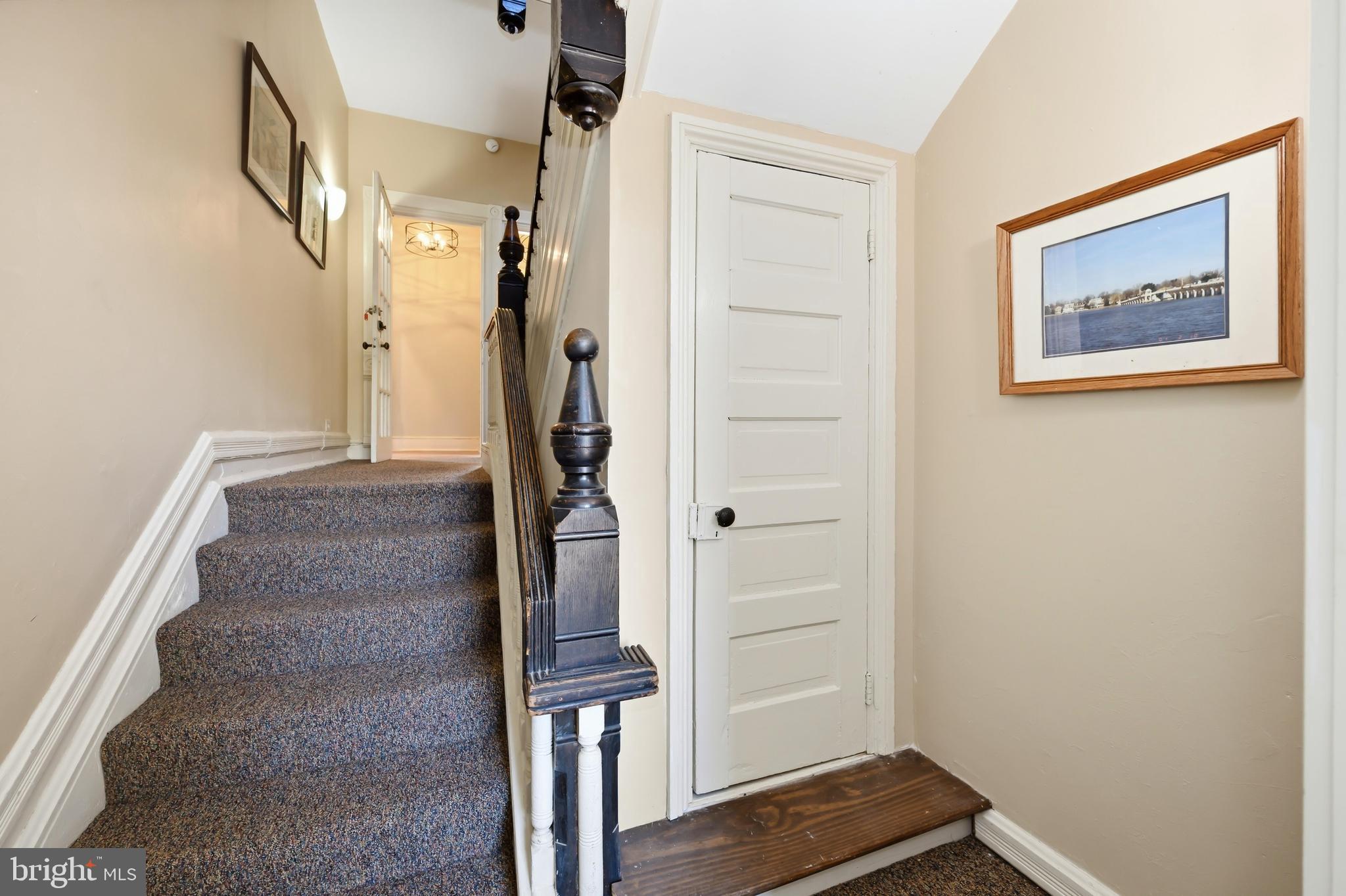 117 North Water Street, Unit 2A Chestertown, MD 21620 - Photo 14 of 24 a view of hallway with stairs and wooden floor
