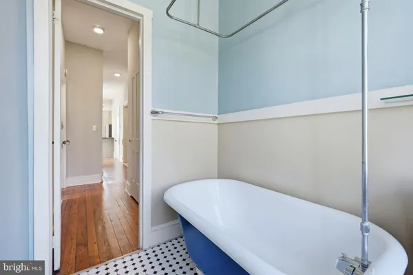 a bathroom with a tub and shower
