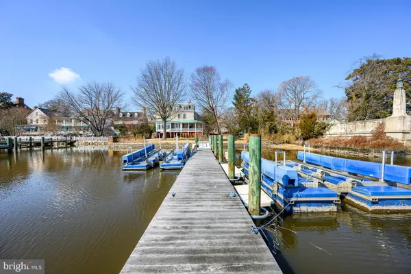a view of boats in a river next to a building