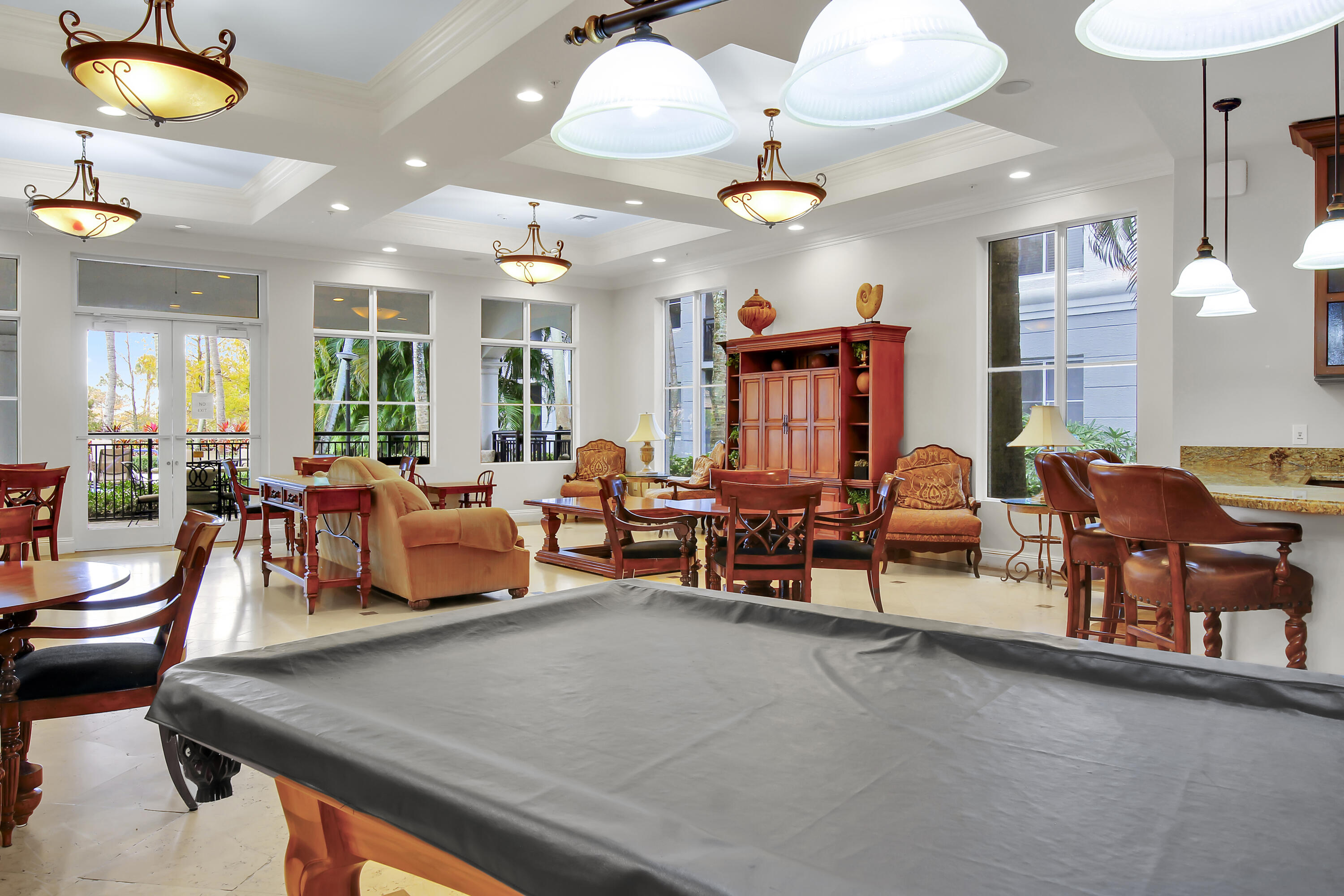 1660 Renaissance Commons Boulevard, Unit 2118 Boynton Beach, FL 33426 - Photo 24 of 24 an outdoor living and dining room