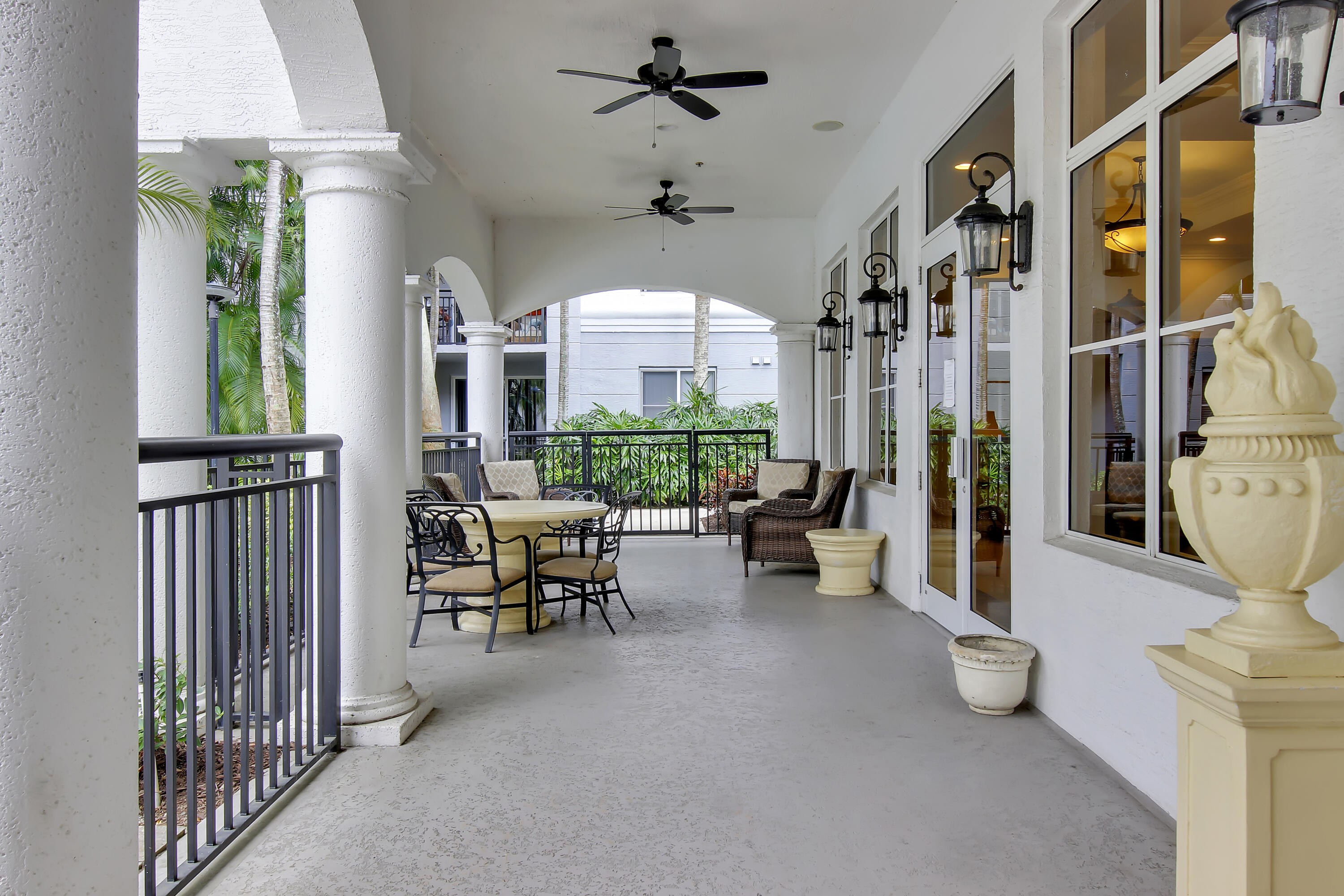 1660 Renaissance Commons Boulevard, Unit 2118 Boynton Beach, FL 33426 - Photo 3 of 24 a view of a livingroom with furniture and a floor to ceiling window
