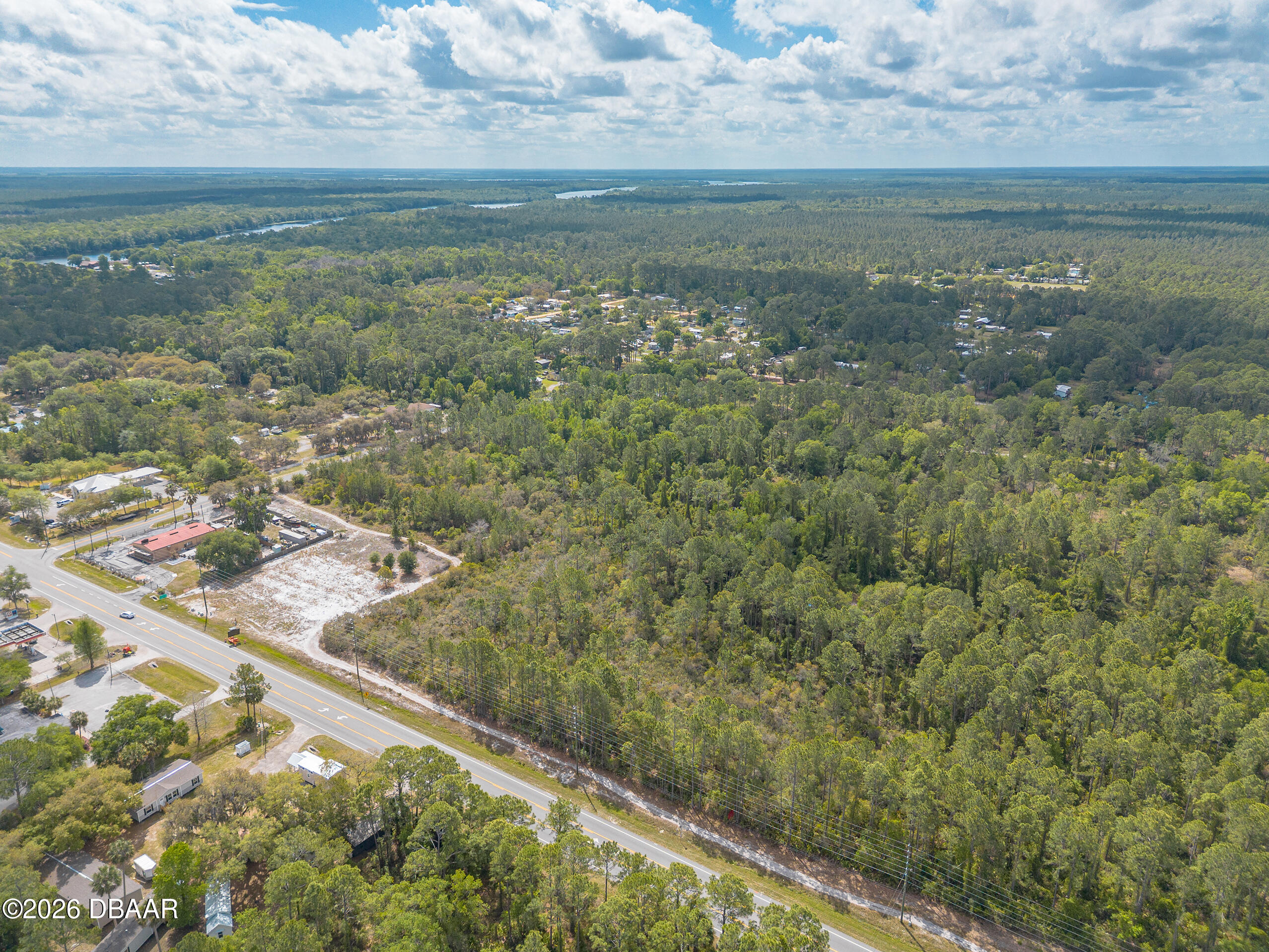 40 Alco Road Astor, FL 32102 - Photo 10 of 13 a view of a lake from a yard