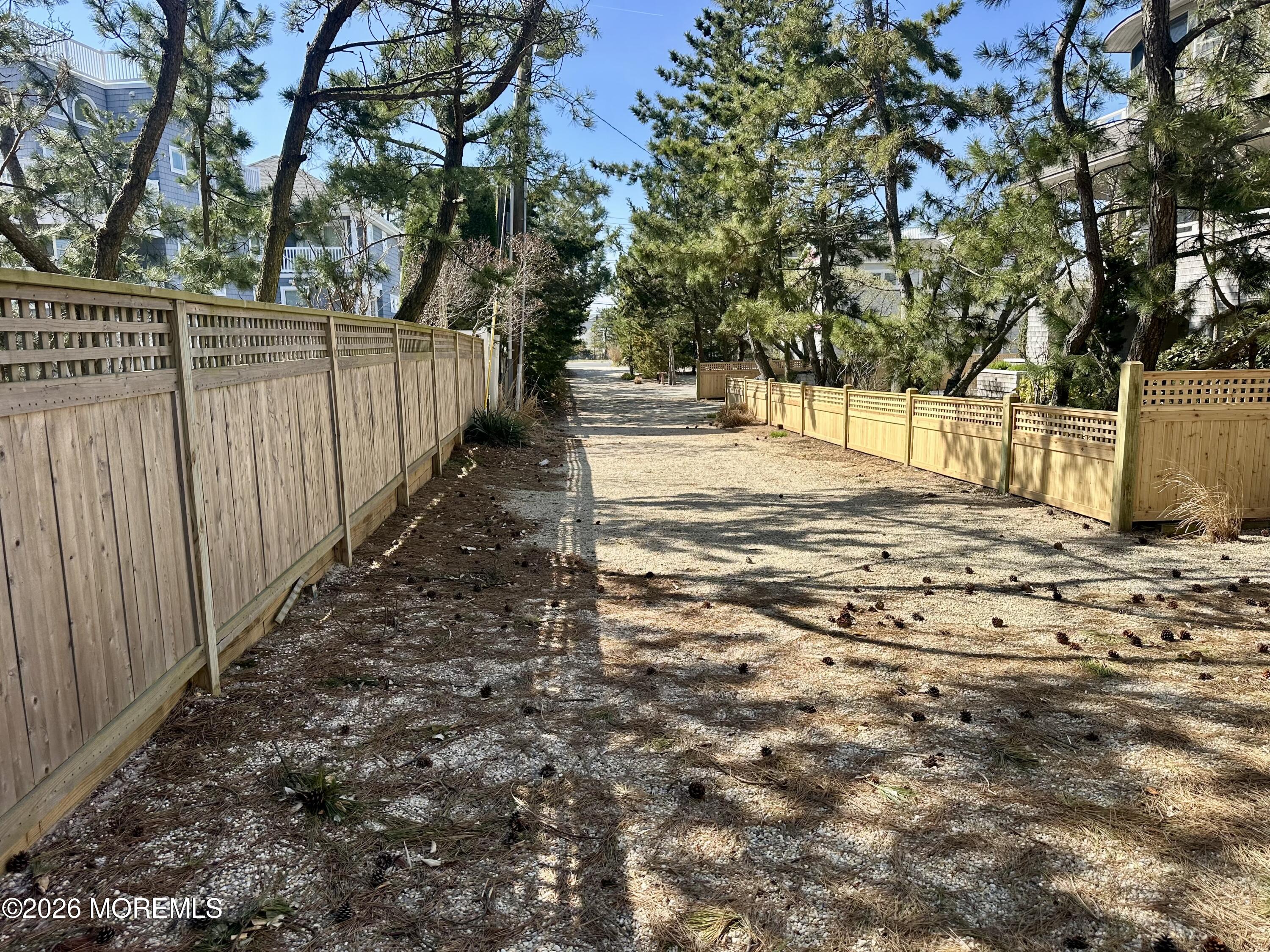 5 Windward Road Beach Haven, NJ 08008 - Photo 13 of 76 a view of a yard with wooden fence
