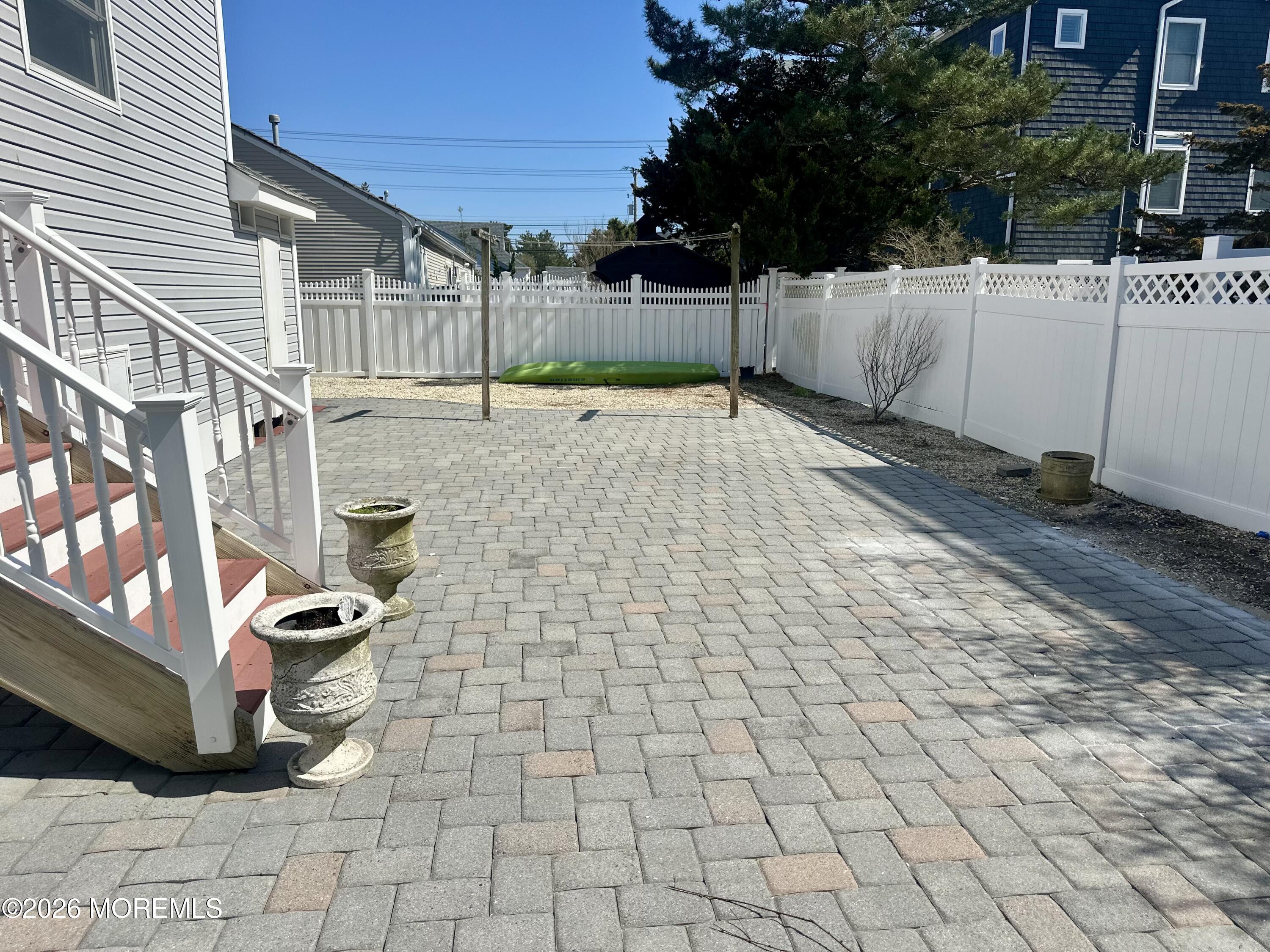 5 Windward Road Beach Haven, NJ 08008 - Photo 19 of 76 a view of a backyard of the house