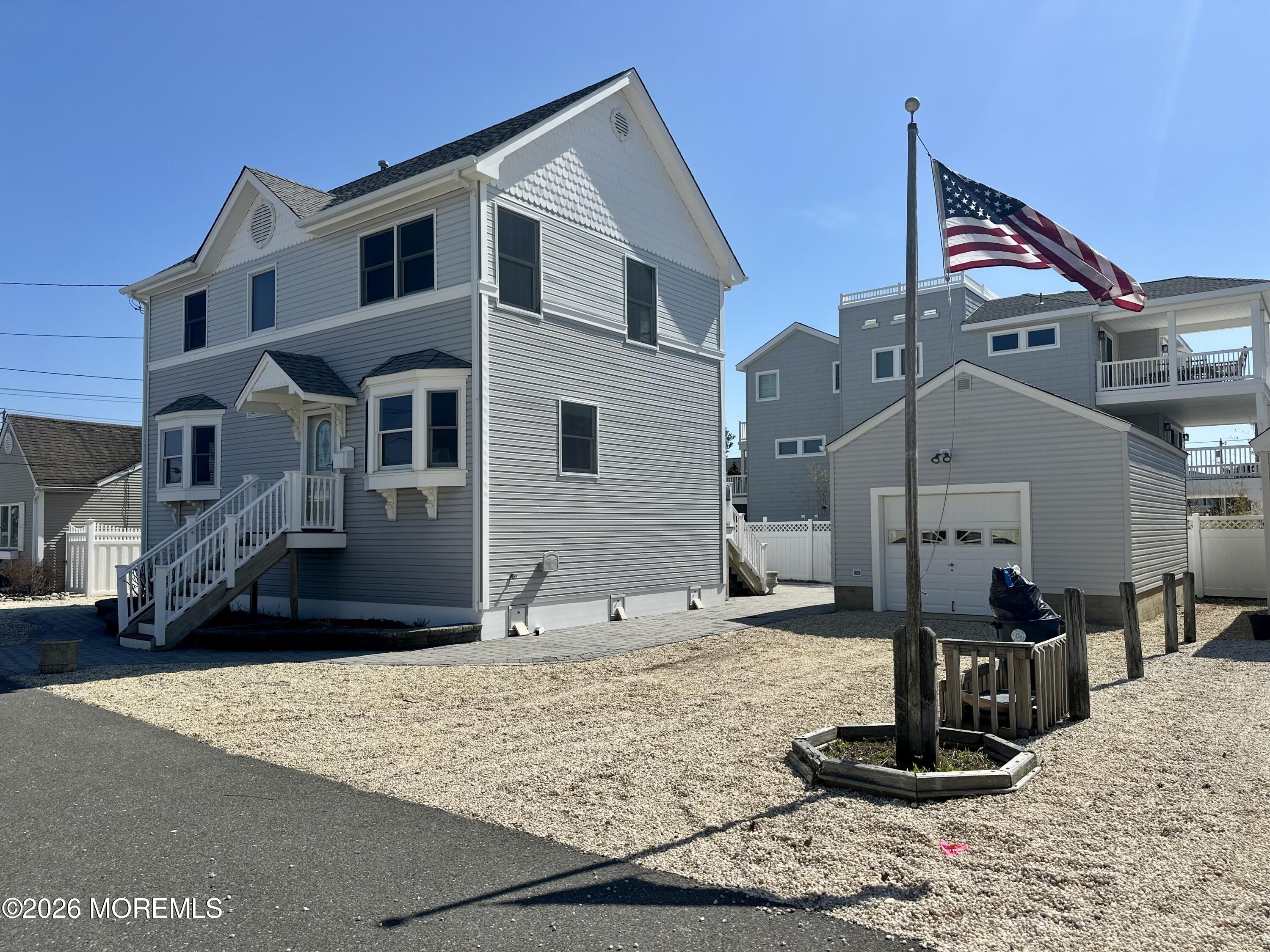 5 Windward Road Beach Haven, NJ 08008 - Photo 2 of 76 a front view of a house with trees