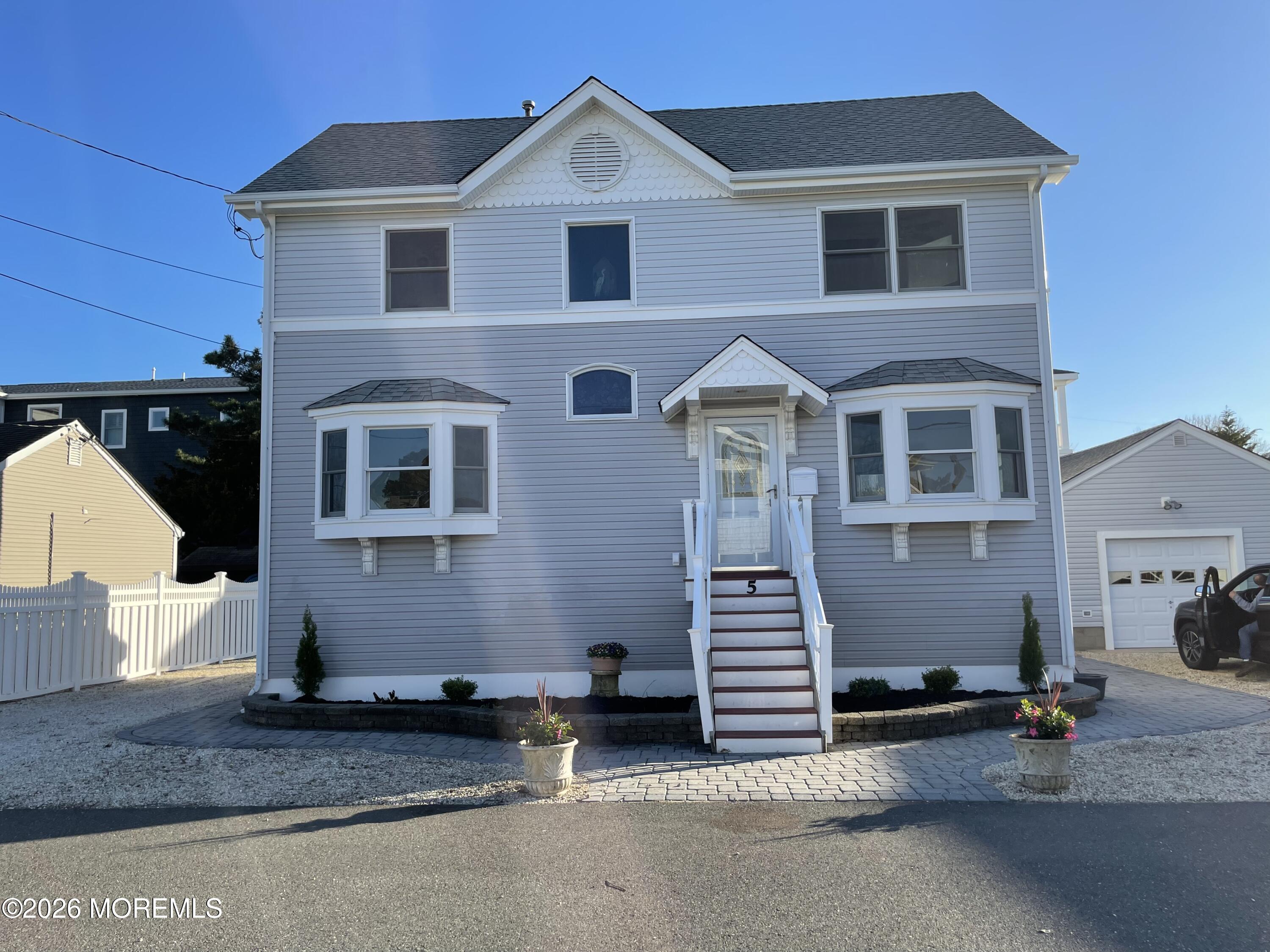 5 Windward Road Beach Haven, NJ 08008 - Photo 3 of 76 a front view of a house with a yard