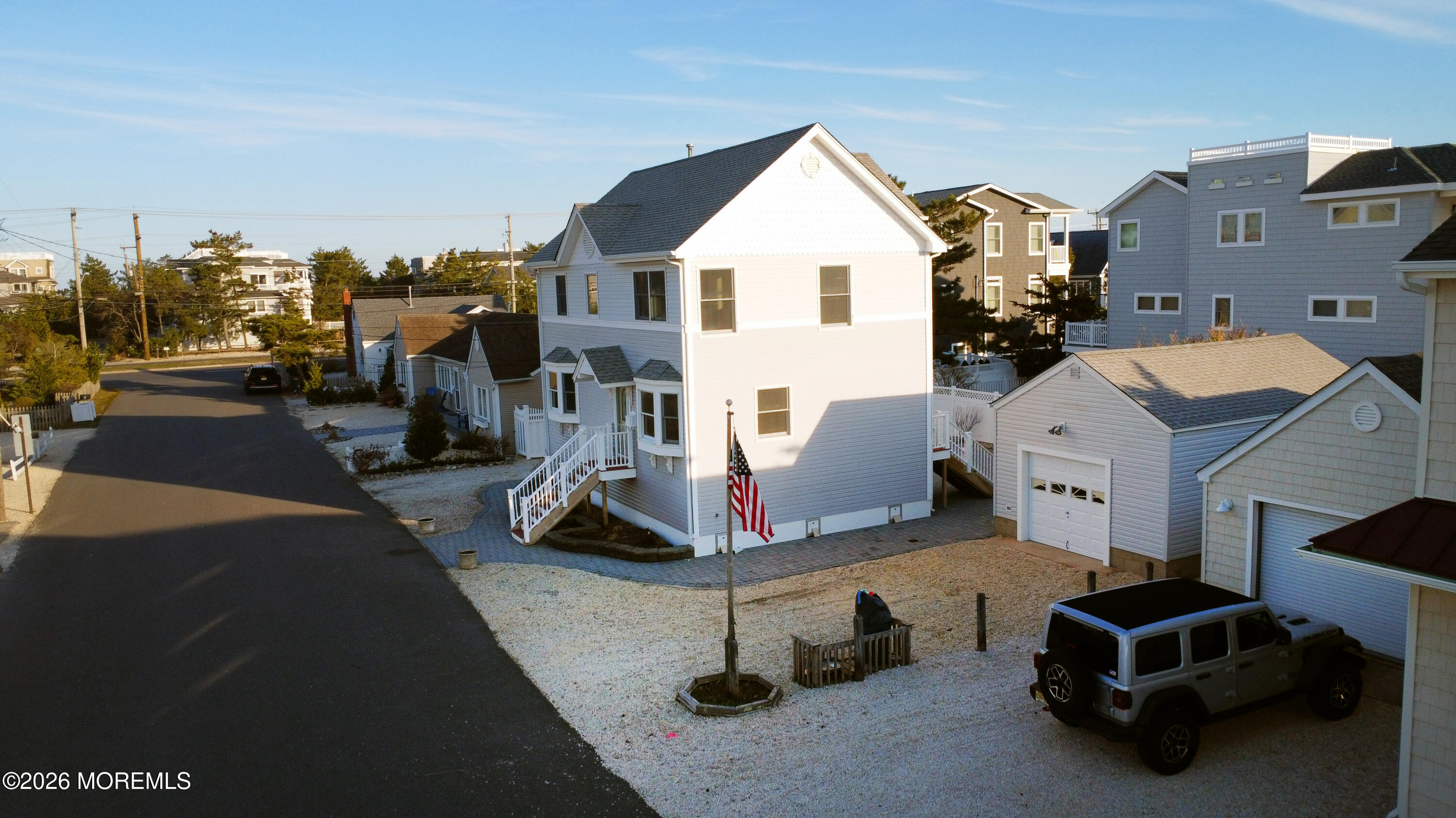 5 Windward Road Beach Haven, NJ 08008 - Photo 44 of 76 a view of a patio with table and chairs