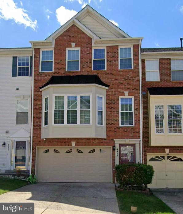 6355 Regal Oak Drive Springfield, VA 22152 - Photo 1 of 1 a front view of a house with a yard