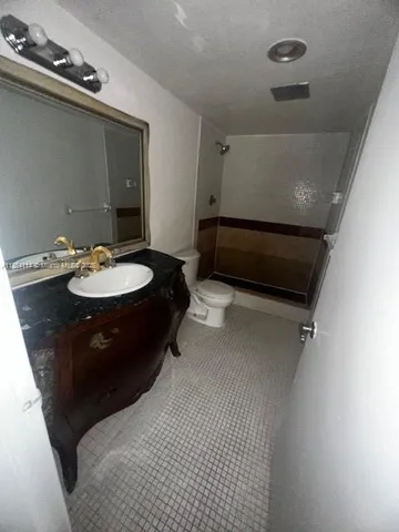 a view of an empty room and fire place