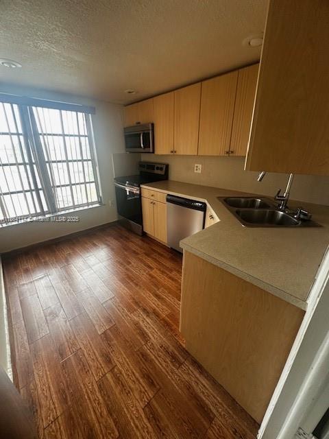 4160 Inverrary Drive, Unit 401 Lauderhill, FL 33319 - Photo 21 of 23 a kitchen with sink a microwave a stove and cabinets