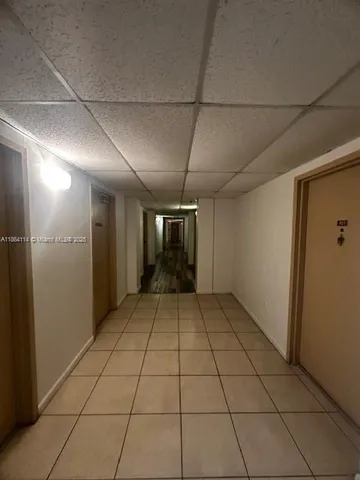 a view of a livingroom with an empty space and a window