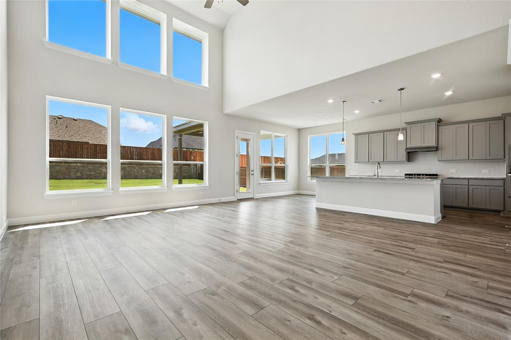 560 Flint Road Waxahachie, TX 75167 - Photo 11 of 40 a view of a kitchen with wooden floor and a window