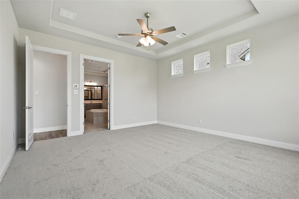 560 Flint Road Waxahachie, TX 75167 - Photo 15 of 40 a view of an empty room with a ceiling fan
