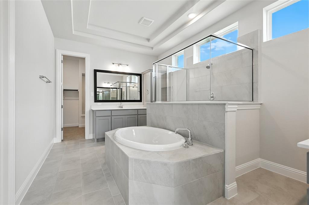 560 Flint Road Waxahachie, TX 75167 - Photo 16 of 40 a bathroom with a sink a toilet and mirror