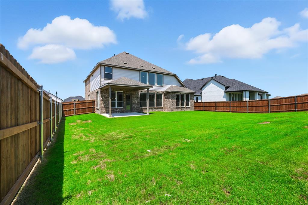 560 Flint Road Waxahachie, TX 75167 - Photo 32 of 40 a view of a house with yard and porch