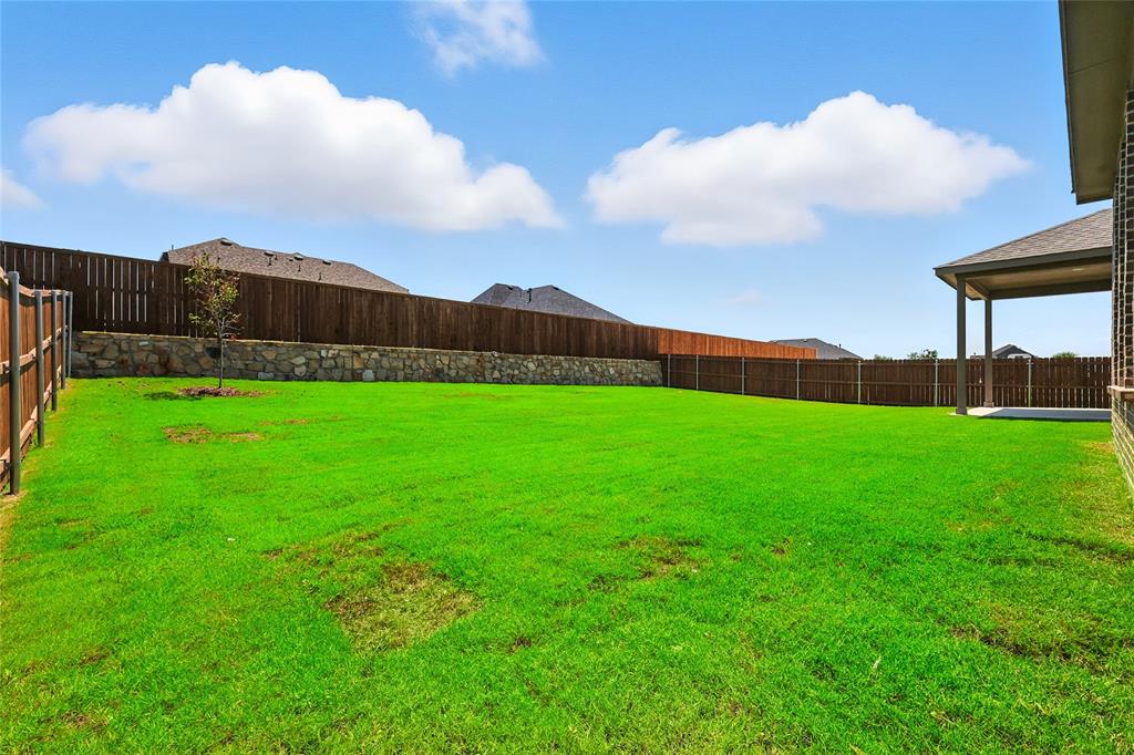 560 Flint Road Waxahachie, TX 75167 - Photo 34 of 40 a view of a backyard with garden