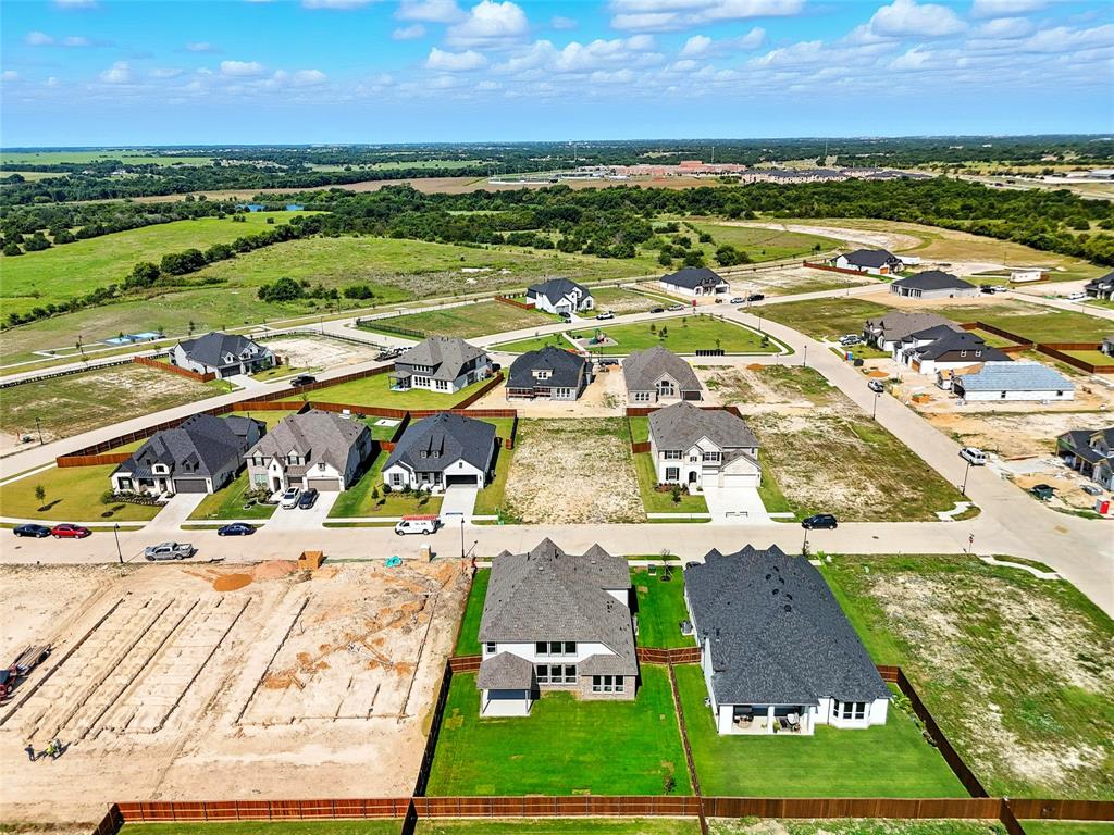560 Flint Road Waxahachie, TX 75167 - Photo 36 of 40 an aerial view of residential houses with outdoor space