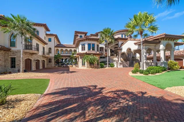 a view of a hallway with wooden floor and windows