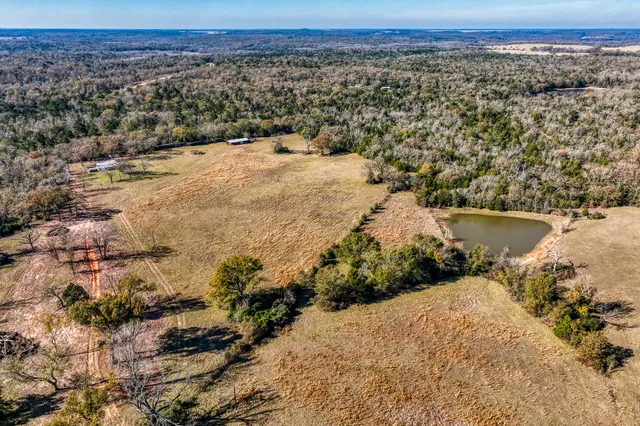 an aerial view of ocean with beach