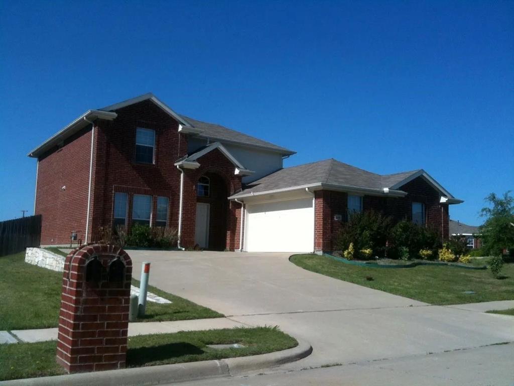 2280 Fieldcrest Drive Rockwall, TX 75032 - Photo 1 of 1 a front view of a house with a yard