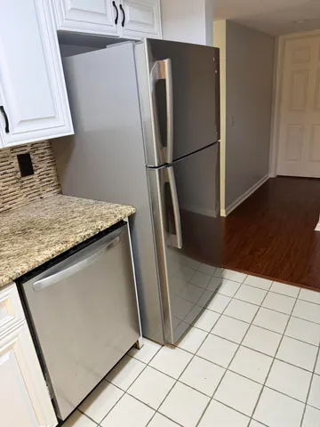 a view of a refrigerator in kitchen