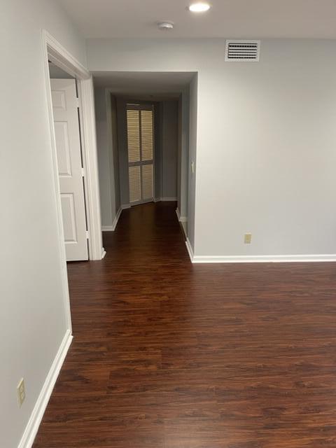 12628 Shoreline Drive, Unit 9C Wellington, FL 33414 - Photo 13 of 32 a view of an empty room with wooden floor and a window