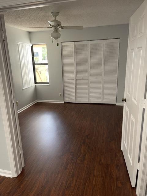 12628 Shoreline Drive, Unit 9C Wellington, FL 33414 - Photo 14 of 32 wooden floor in an empty room with a window