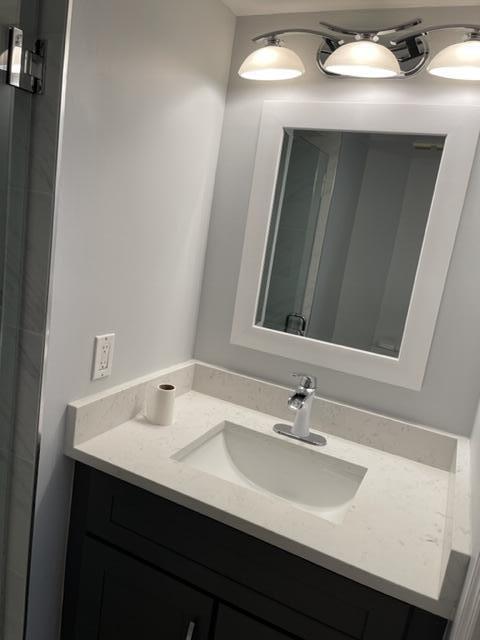 12628 Shoreline Drive, Unit 9C Wellington, FL 33414 - Photo 18 of 32 a bathroom with a sink and a mirror
