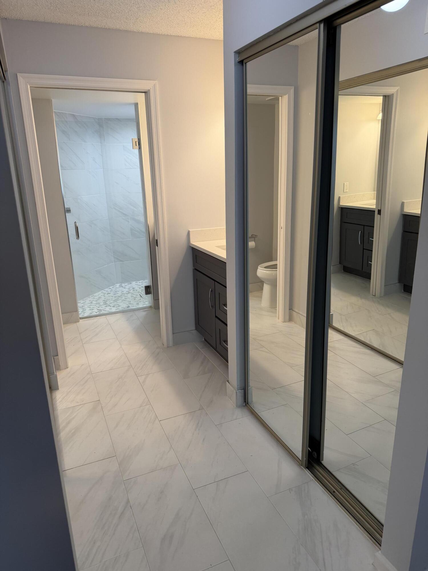 12628 Shoreline Drive, Unit 9C Wellington, FL 33414 - Photo 24 of 32 a view of a hallway to rooms