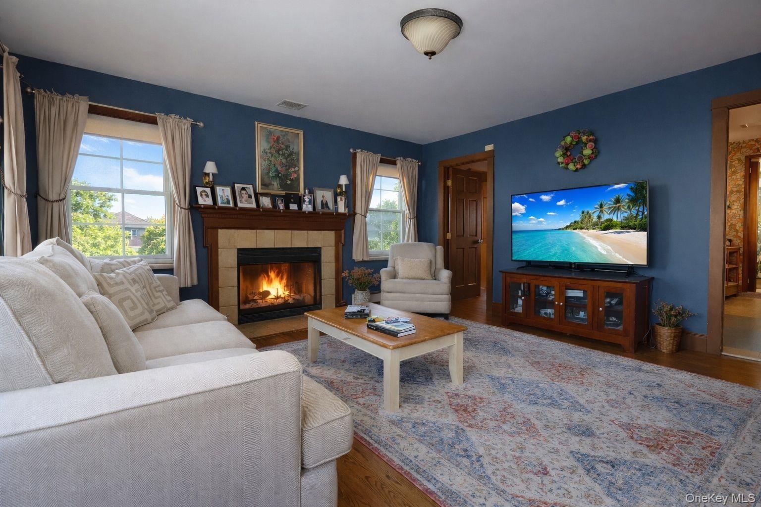 90 South Middletown Road Pearl River, NY 10965 - Photo 12 of 47 a living room with furniture a flat screen tv and a fireplace