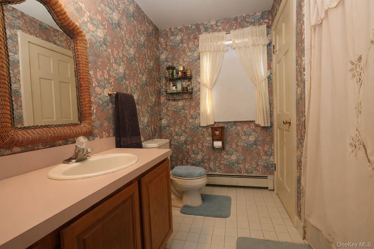 90 South Middletown Road Pearl River, NY 10965 - Photo 15 of 47 a bathroom with a sink a toilet and shower