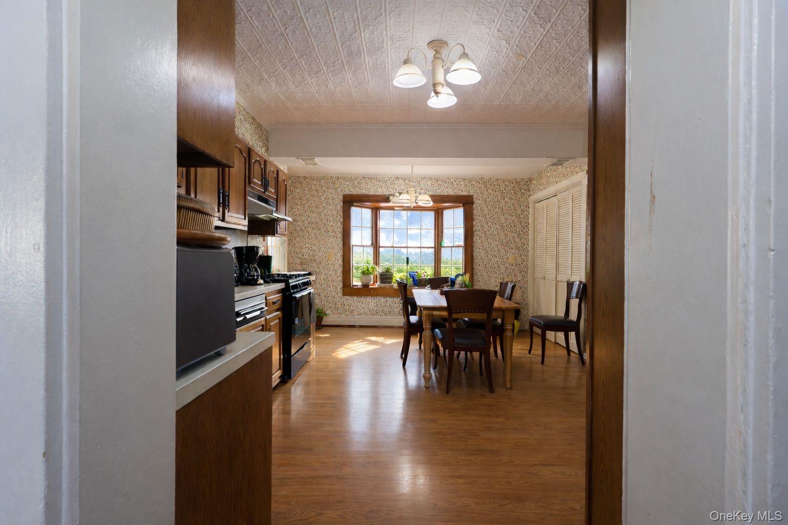 90 South Middletown Road Pearl River, NY 10965 - Photo 19 of 47 a view of a dining room with furniture and a chandelier