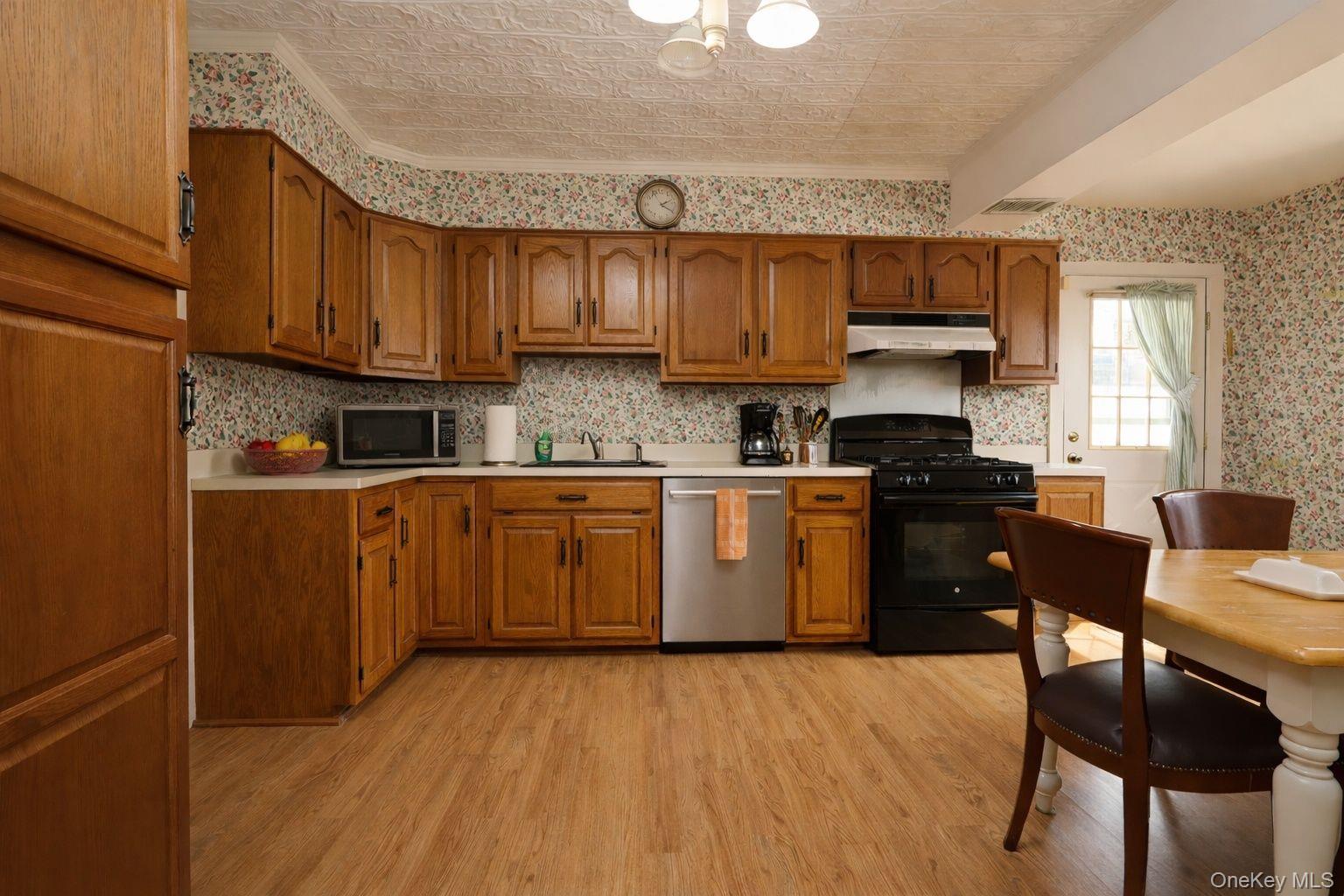 90 South Middletown Road Pearl River, NY 10965 - Photo 20 of 47 a kitchen with a sink a counter top space cabinets and stainless steel appliances